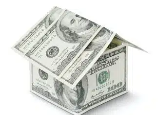 Investissement à long terme: pourquoi et comment le faire a house made out of money on a white background