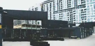 black concrete building near high-rise buildings