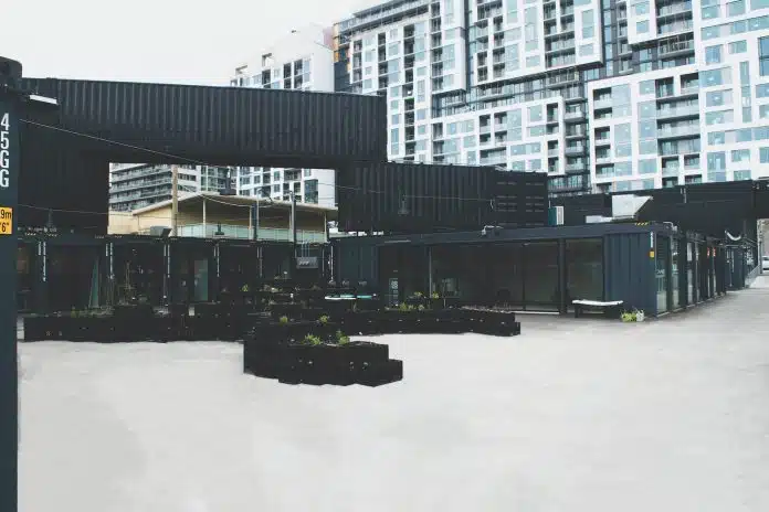 black concrete building near high-rise buildings