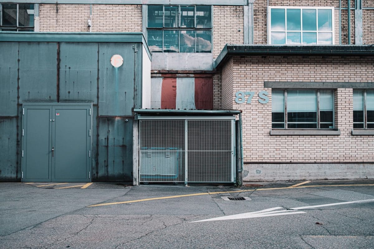 red brick building with black metal gate